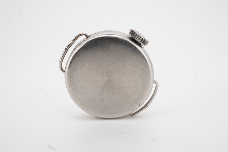 A lady's mid 20th century white metal and diamond set Vertex manual wind wrist watch, with dot and Arabic numerals, case diameter 21mm, no strap.